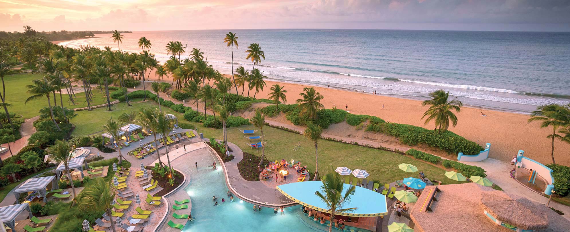 Birds-eye-view of the oceanfront pool at Margaritaville Vacation Club by Wyndham - Rio Mar timeshare resort in Puerto Rico.