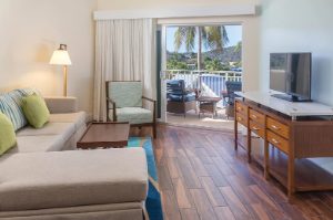 Couch and tv in the living room of a suite at Margaritaville Vacation Club by Wyndham - St. Thomas.